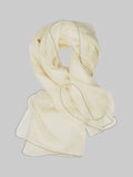 A cream-colored lightweight cashmere scarf with delicate black stitched edges, arranged in a loose loop on a light gray background.